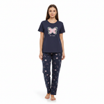 A woman modeling a navy blue two-piece pajama set. The short-sleeve top features a pink and white butterfly graphic with the text 'I love you' underneath.