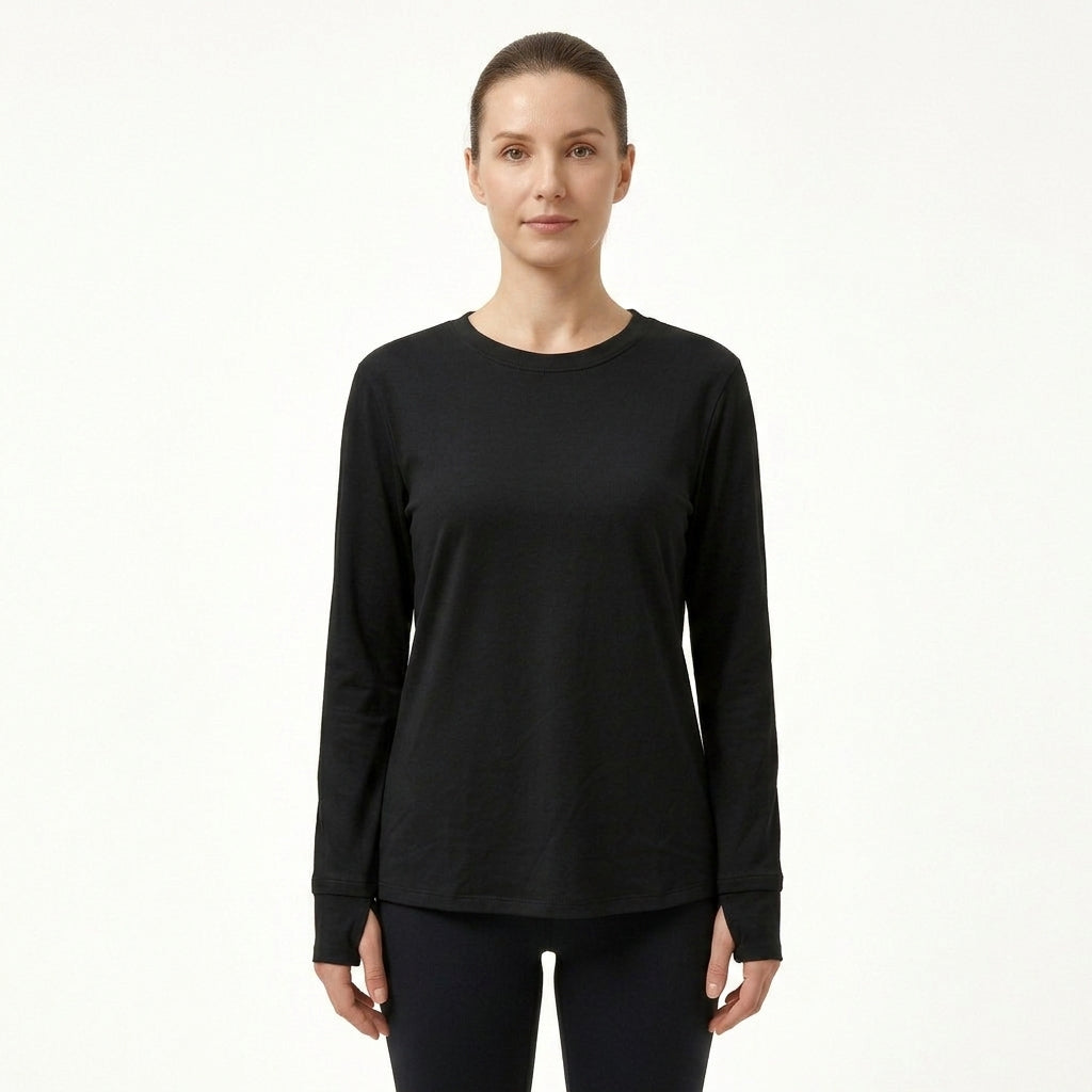 A woman modeling a black long-sleeve crewneck top against a plain white studio background.