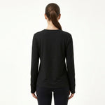 Back view of JOANNA FASHION black long sleeve crewneck loungewear top with thumbhole cuffs on a model