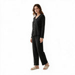 JOANNA FASHION black polka-dot long sleeve button-down pajama set with scalloped trim on a model