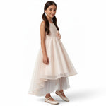JOANNA FASHION girl wearing a blush pink sleeveless formal dress with lace bodice, floral waist, and high-low tulle skirt