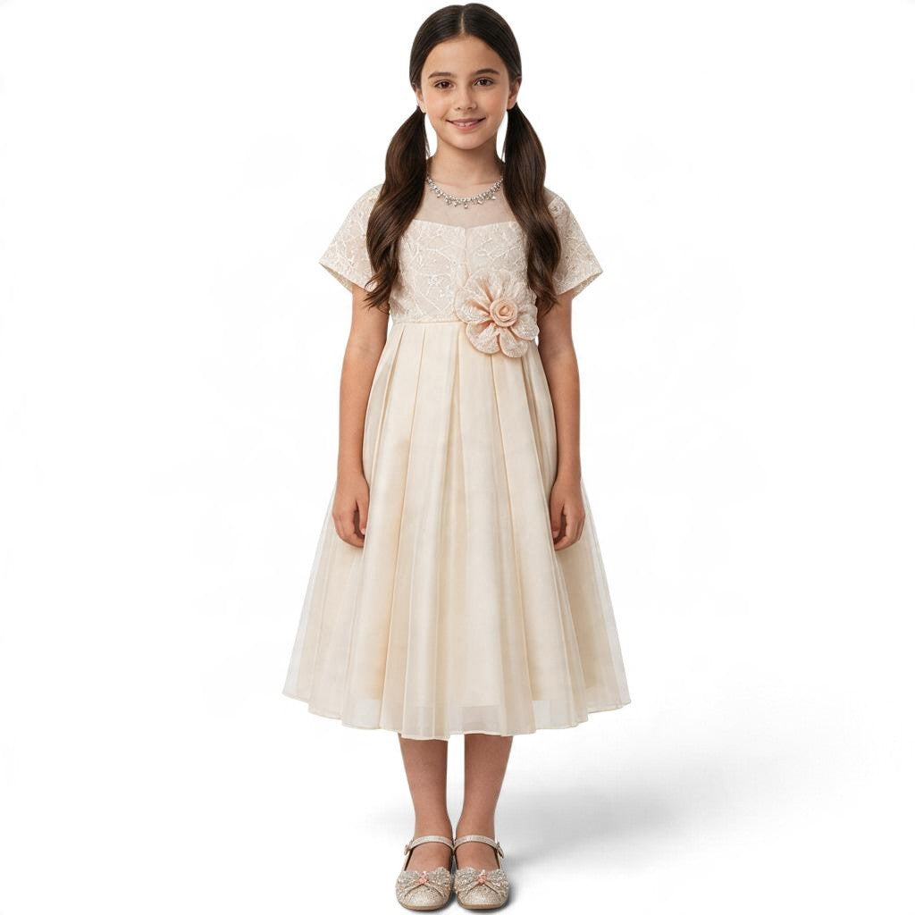 JOANNA FASHION girl in a champagne formal dress with lace bodice, short sleeves, floral waist accent, and tulle skirt.