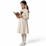JOANNA FASHION cream long-sleeve dress with Peter Pan collar, brown bow, and textured fabric worn by a young girl.