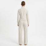Back view of a woman wearing a JOANNA FASHION cream full-zip track jacket and matching wide-leg lounge pants.