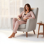 JOANNA FASHION three-piece floral pajama set with lace trim, worn by a woman sitting in a grey armchair.