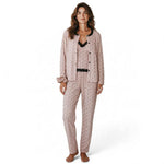 Model wearing a JOANNA FASHION three-piece floral pajama set in soft pink with black lace trim and matching scrunchie.