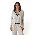 Model wearing a JOANNA FASHION three-piece floral pajama set with black lace trim, camisole, trousers, and cardigan.