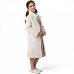 JOANNA FASHION cream wool-blend formal coat for girls with faux-fur cuffs and hem, worn over a pink dress.