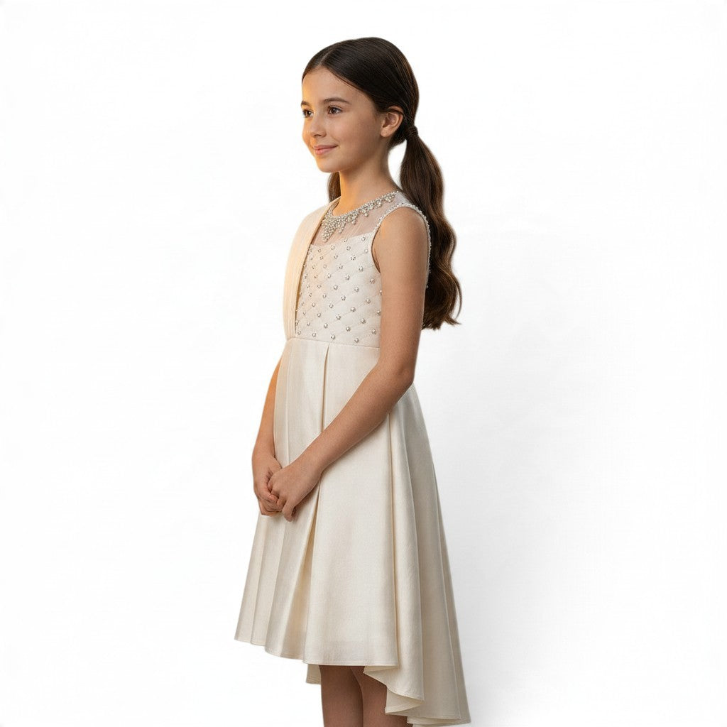 JOANNA FASHION girls' formal dress with pearl-beaded illusion neckline and high-low pleated skirt in neutral cream.