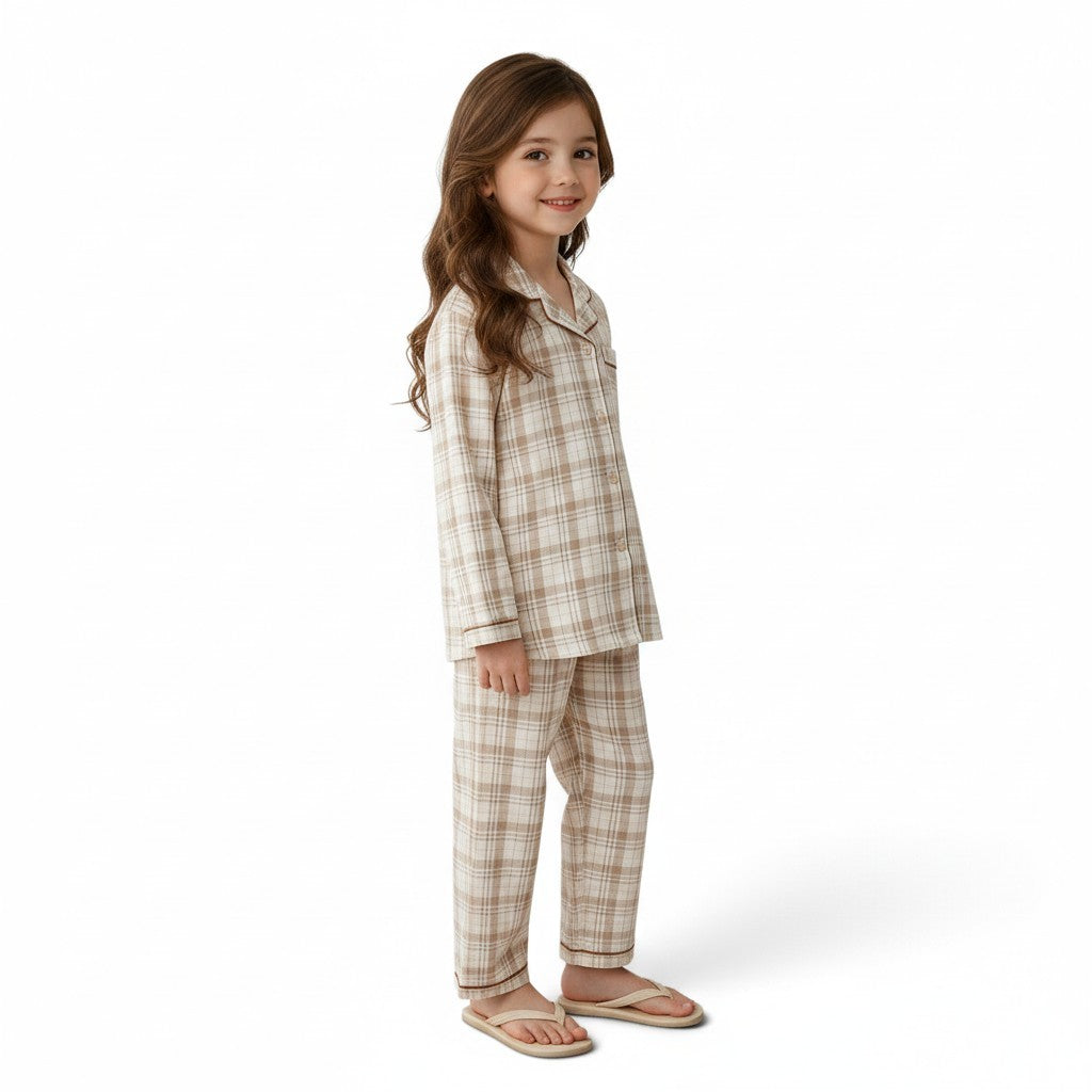 Young girl wearing a JOANNA FASHION neutral plaid button-down pajama set with contrast piping and long pants.
