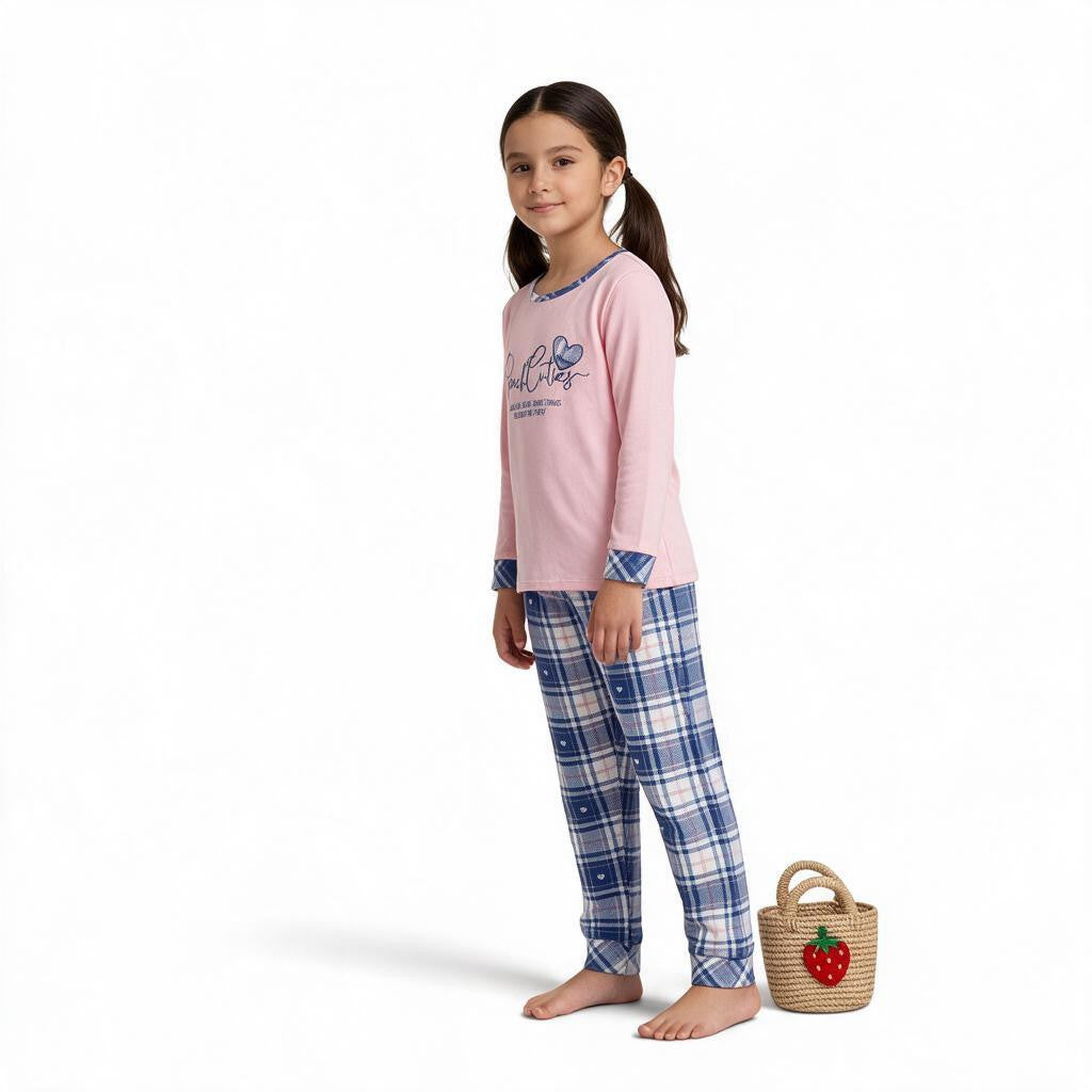 JOANNA FASHION girls' pink long sleeve pajama set with graphic top and blue plaid bottoms on a young girl