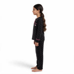 JOANNA FASHION girls black long sleeve pajama set with pink polka dots, chest pocket, and heart detail, side view.
