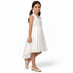 JOANNA FASHION girls' white formal dress with pearl-beaded bodice, illusion neckline, and high-low pleated skirt.