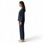 JOANNA FASHION navy blue polka-dot long sleeve pajama set with scalloped trim worn by a woman in profile view