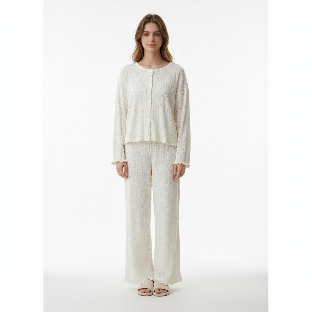Model wearing a JOANNA FASHION off-white two-piece lounge set with a button-down top and wide-leg trousers.