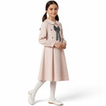 JOANNA FASHION girl wearing a pale pink long-sleeve dress with a Peter Pan collar, grey bow, and pleated skirt.