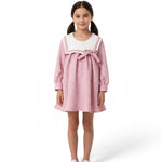 JOANNA FASHION pink quilted long sleeve dress with a white sailor collar and bow detail worn by a young girl