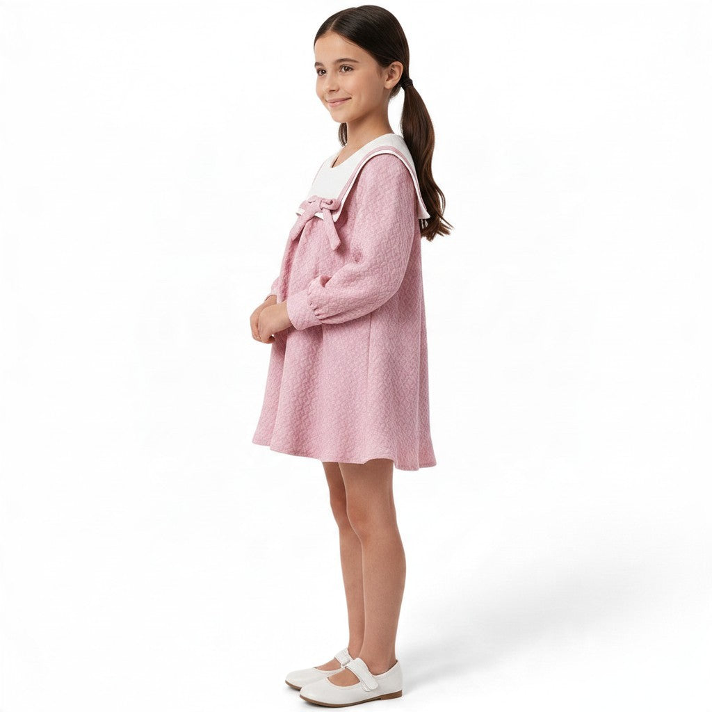 JOANNA FASHION pink textured A-line dress with white sailor collar and bow detail worn by a young girl
