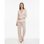 JOANNA FASHION light pink long sleeve pajama set with black star print, scoop neck, and black bow detail on model