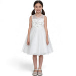 JOANNA FASHION white flower girl dress with sheer neckline, oversized floral applique, and layered tulle skirt.