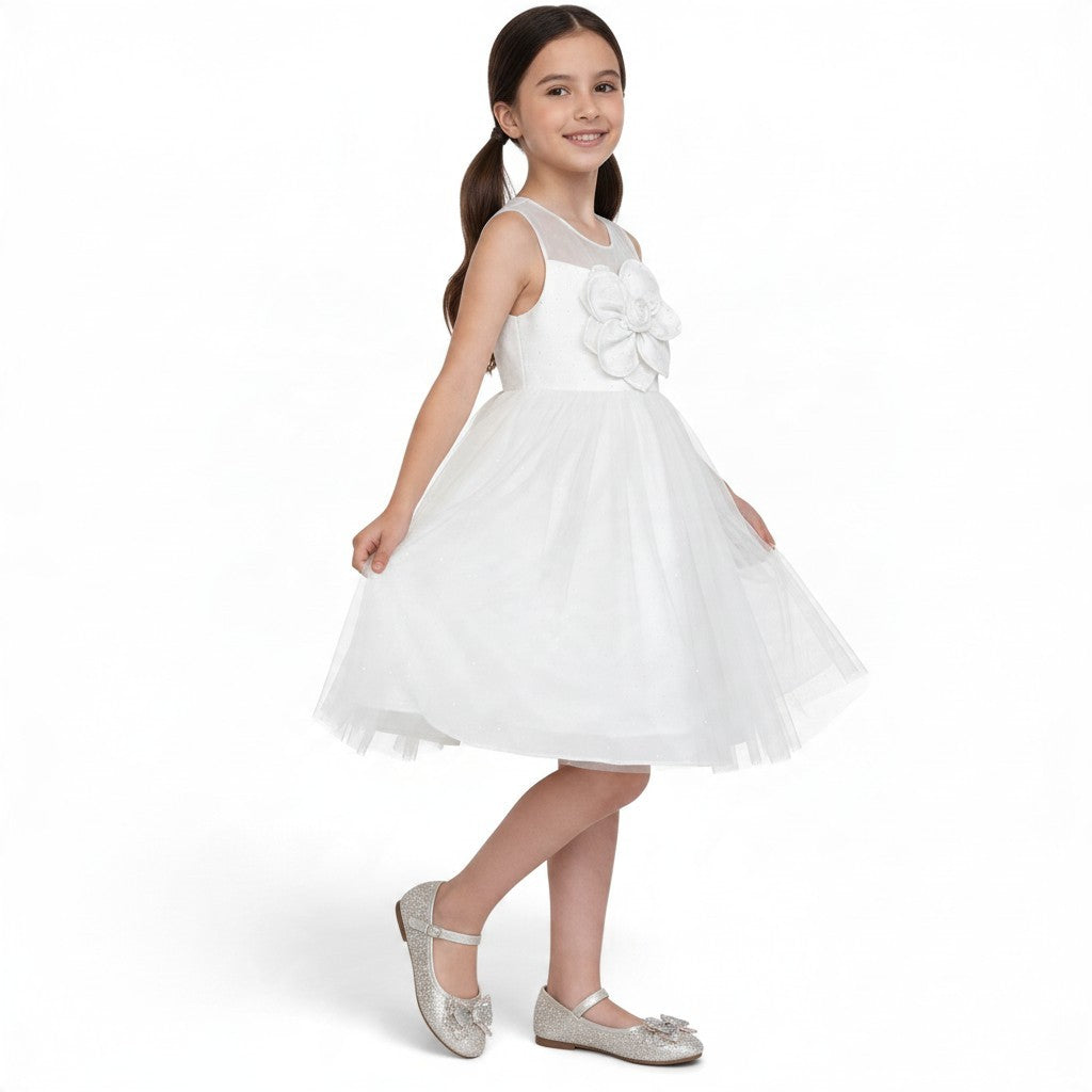JOANNA FASHION white sleeveless flower girl dress with a sheer neckline, floral applique, and layered tulle skirt.