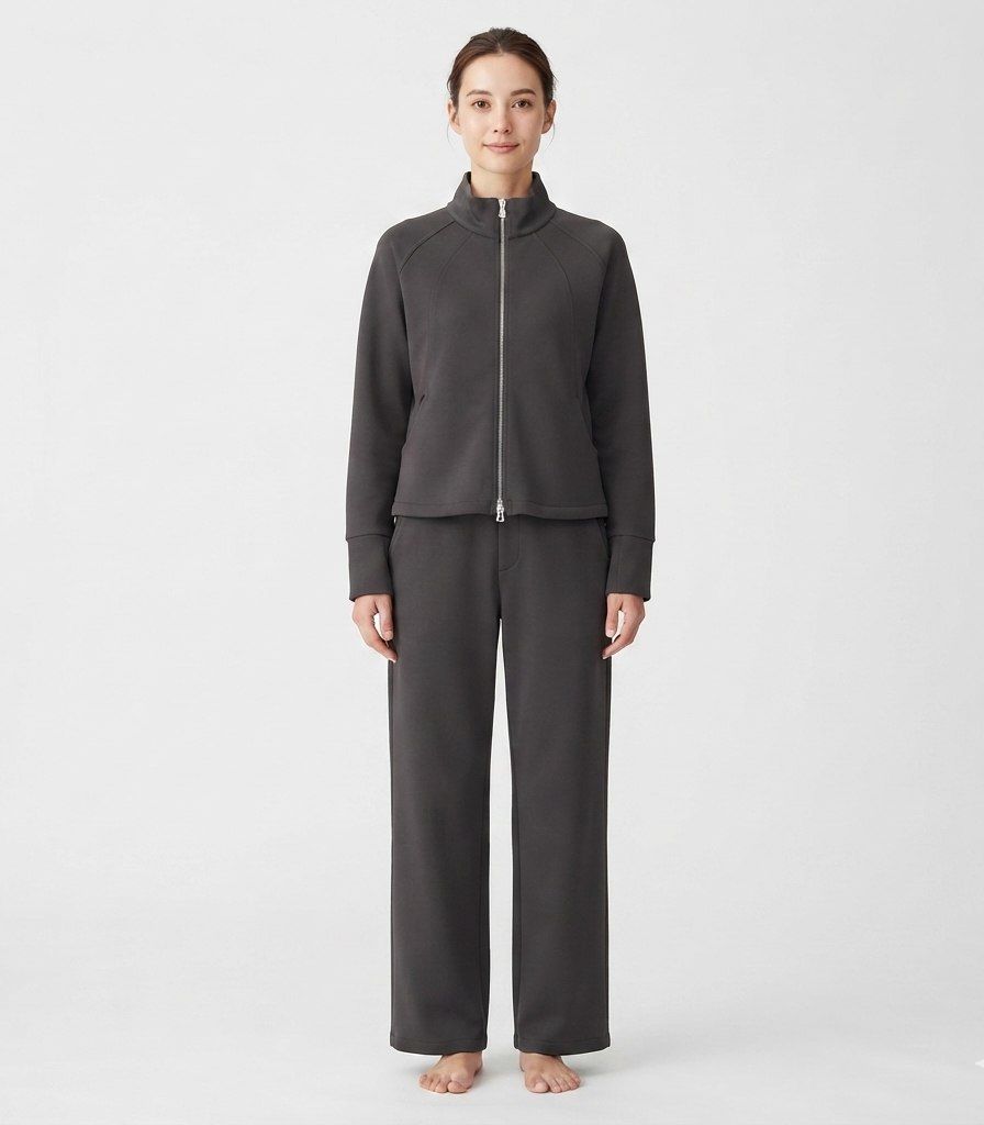 Crafted from a soft and breathable cotton blend, this cozy matching loungewear set offers relaxed comfort and effortless versatility for daily wear. The zip-up jacket features a sleek stand collar and raglan sleeves, paired seamlessly with full-length straight pants for a smooth, tailored fit. Designed for lounging at home or casual everyday outings, it delivers a modern style that keeps you comfortably cozy.