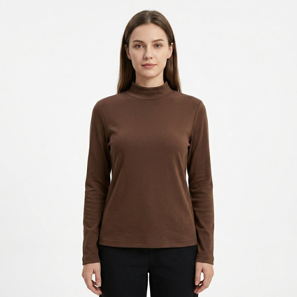 A woman modeling a brown mock neck long-sleeve top against a plain white background.
