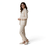 JOANNA FASHION beige plaid button-down pajama set with long sleeves and piping details worn by a woman.