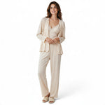 A model wearing a JOANNA FASHION beige three-piece ribbed loungewear set with a lace-trimmed camisole and cardigan.