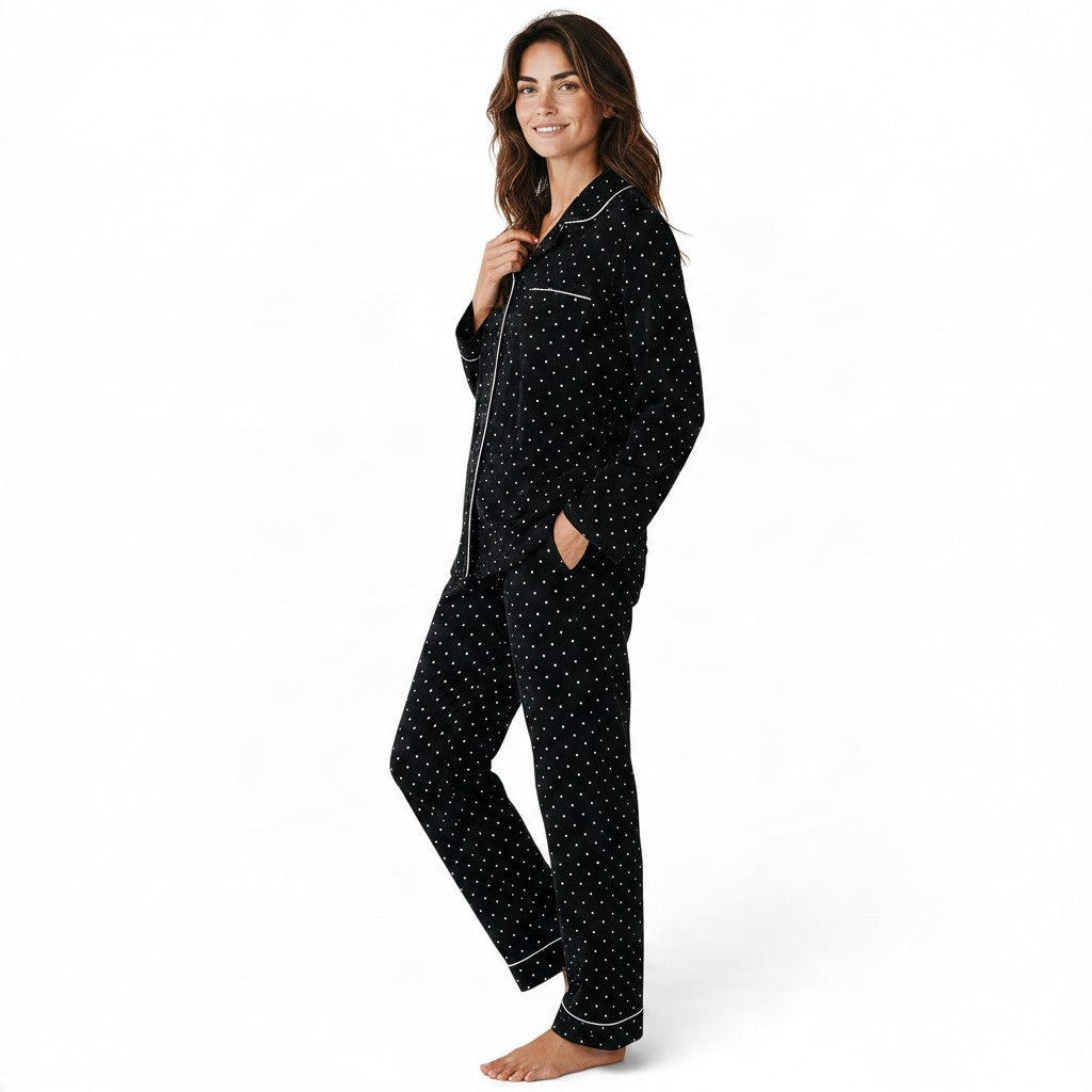 JOANNA FASHION black polka dot button-down pajama set with white contrast piping worn by a smiling woman