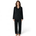 JOANNA FASHION black polka dot pajama set with button-down top, notched collar, and contrast piping on a model