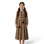 A girl wearing a JOANNA FASHION brown long-sleeve dress with a plaid Peter Pan collar, floral buttons, and pom-pom belt.