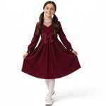 JOANNA FASHION burgundy corduroy long-sleeve dress with a pleated skirt and pearl-embellished butterfly waist detail.