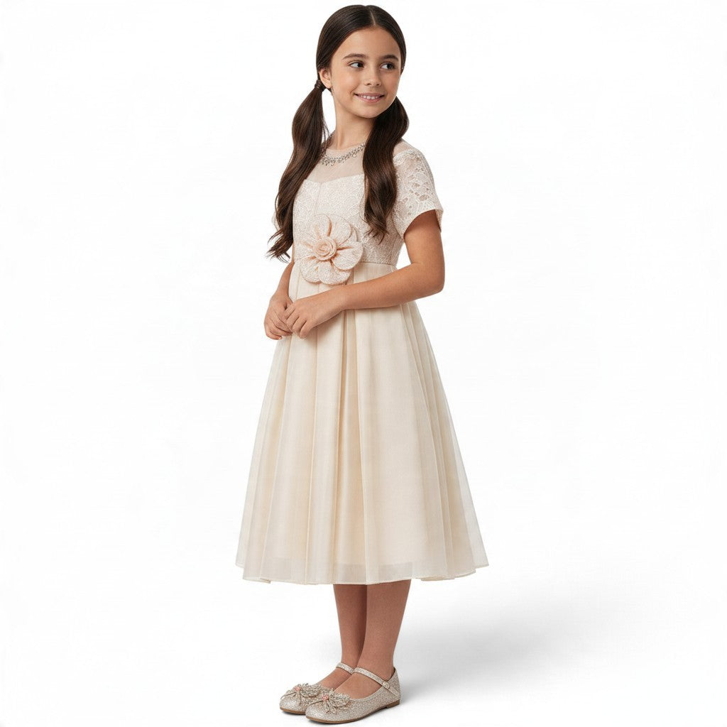JOANNA FASHION girl in a champagne formal dress with lace bodice, floral waist accent, and layered tulle skirt.