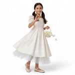 JOANNA FASHION girl's cream satin formal dress with puff sleeves, pearl accents, and a layered tulle skirt.