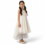 JOANNA FASHION girl in a cream high-low formal dress with lace bodice, floral waist accent, and layered tulle skirt.