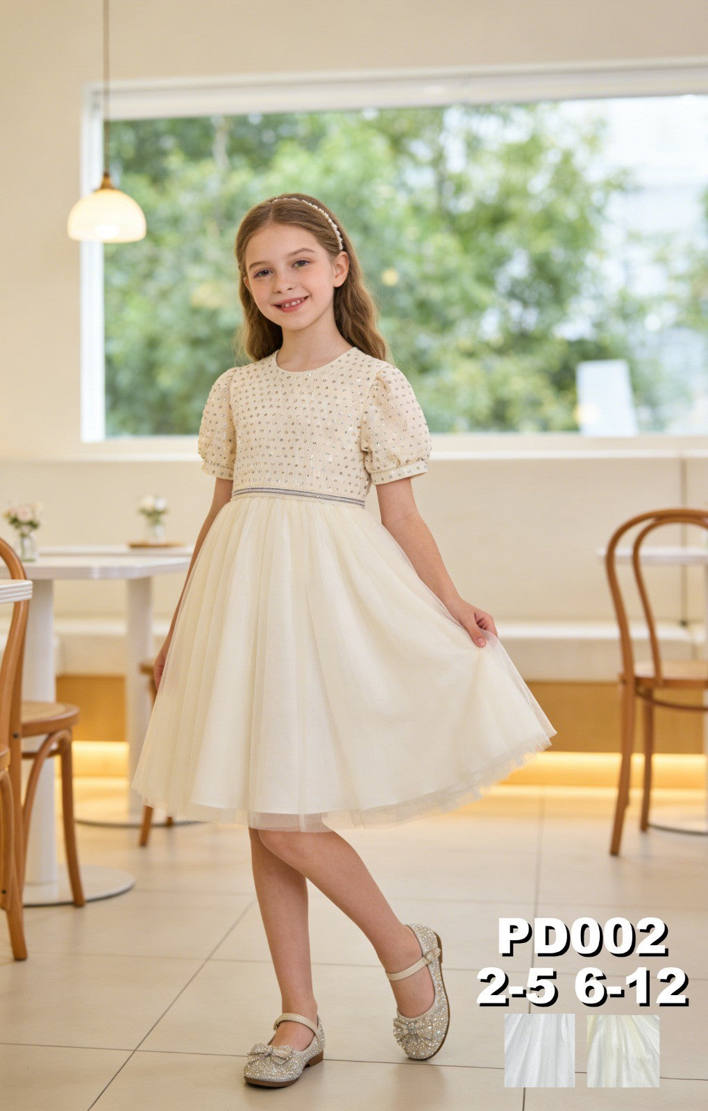 JOANNA FASHION cream party dress with puff sleeves, embellished bodice, and tulle skirt worn by a young girl