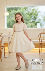 JOANNA FASHION cream party dress with puff sleeves, embellished bodice, and tulle skirt worn by a young girl