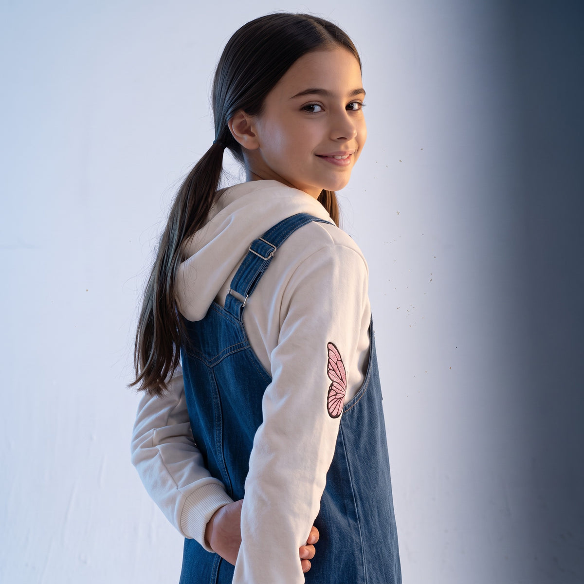JOANNA FASHION girls denim pinafore dress with white hoodie featuring pink butterfly sleeve detail