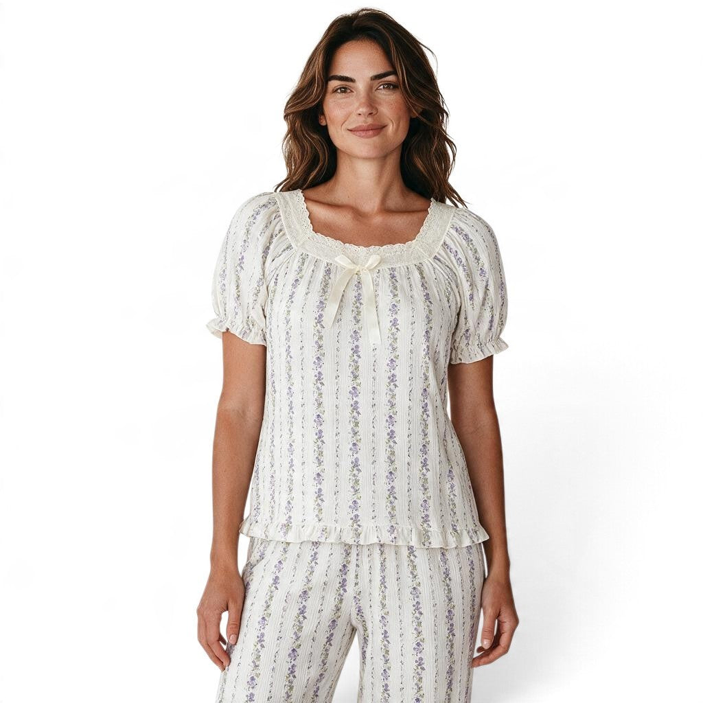 JOANNA FASHION floral print pajama set with puff sleeves, square neckline, lace trim, and ribbon bow on a model