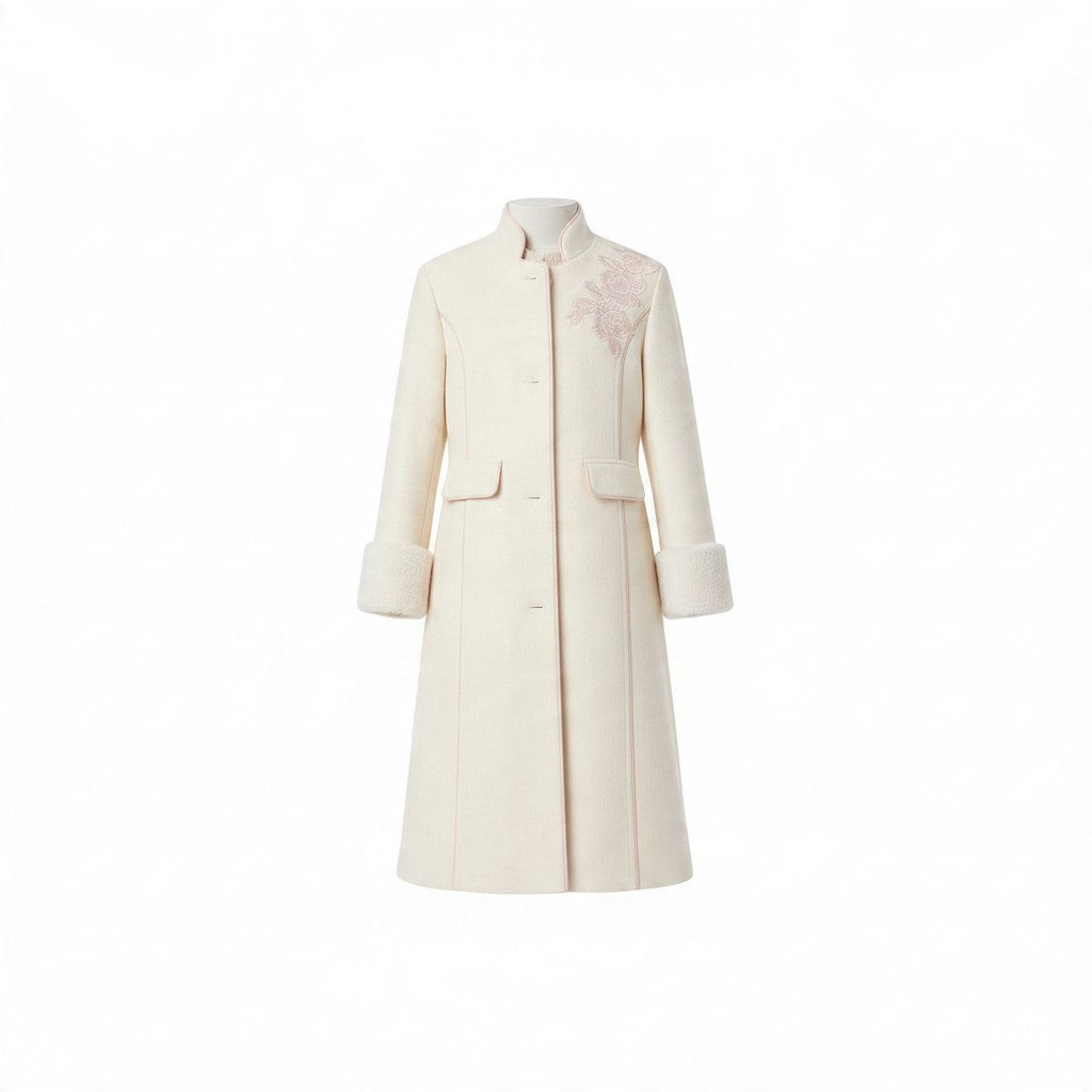 JOANNA FASHION girls cream long formal winter coat with floral embroidery on the shoulder and plush faux-fur cuffs.