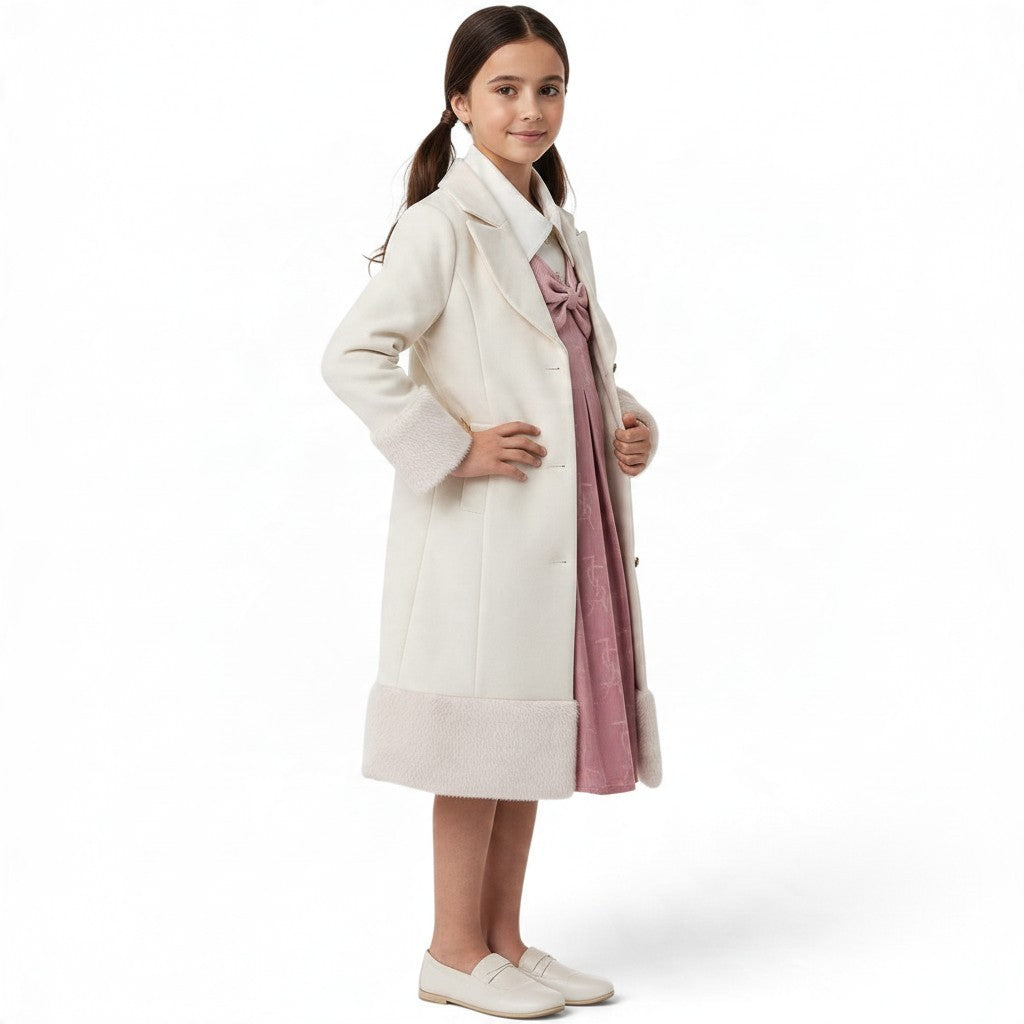 JOANNA FASHION girls' cream wool-blend formal coat with faux-fur cuffs and hem worn over a pink dress