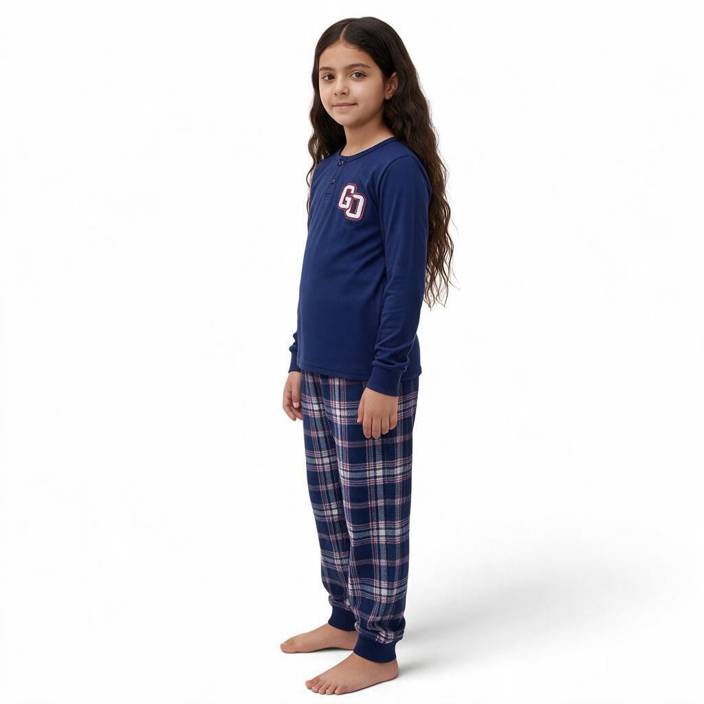 JOANNA FASHION girls long sleeve navy henley pajama set with collegiate graphic and plaid bottoms on a young girl