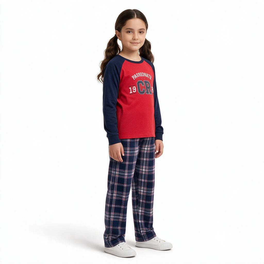 JOANNA FASHION girls long sleeve raglan pajama set with red top and navy blue plaid bottoms on a young girl