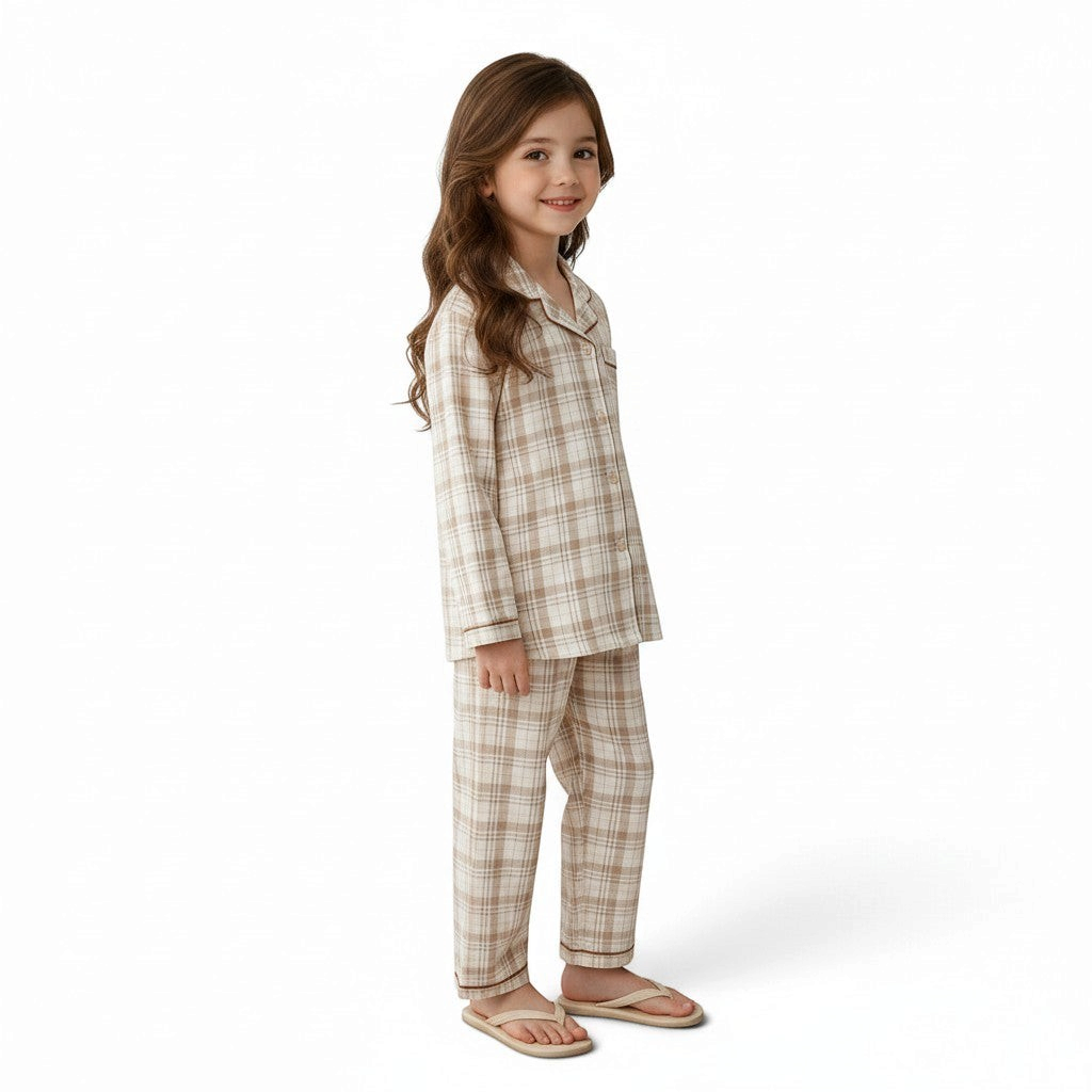 Young girl wearing a JOANNA FASHION neutral plaid button-down pajama set with contrast piping and long pants.