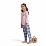 JOANNA FASHION girls' pink long sleeve pajama set with graphic top and blue plaid bottoms on a young girl