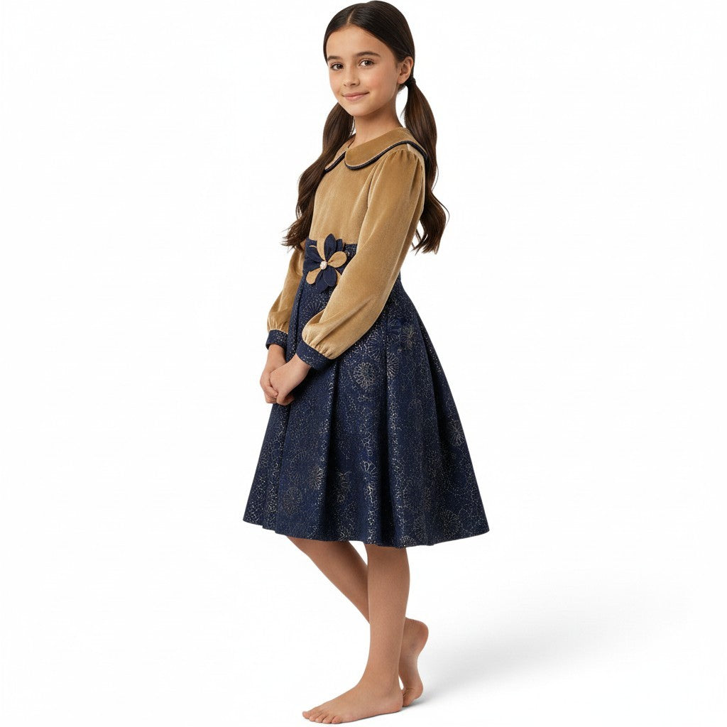 JOANNA FASHION girls' long sleeve dress with a gold velvet bodice, navy metallic skirt, and floral waist detail.