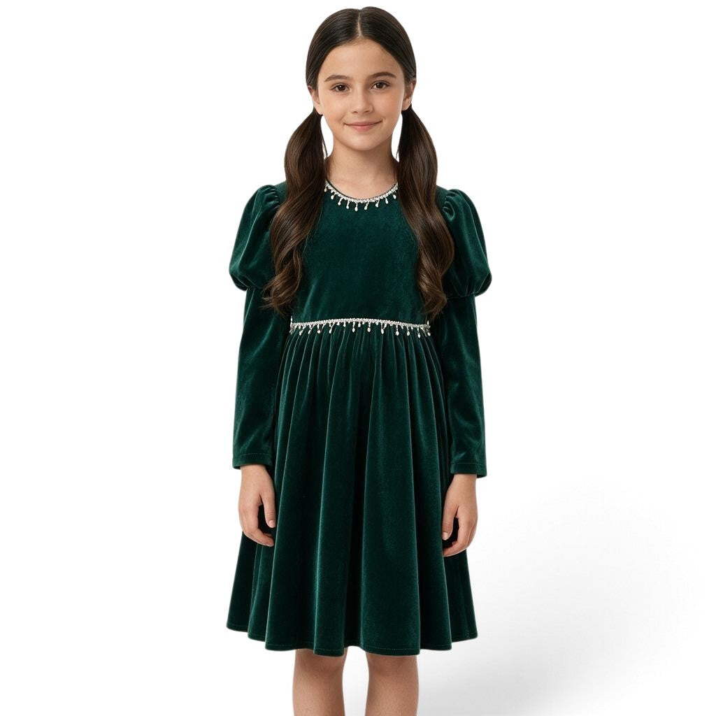 JOANNA FASHION girl wearing a dark green velvet dress with puff sleeves and pearl-style trim at the neckline and waist