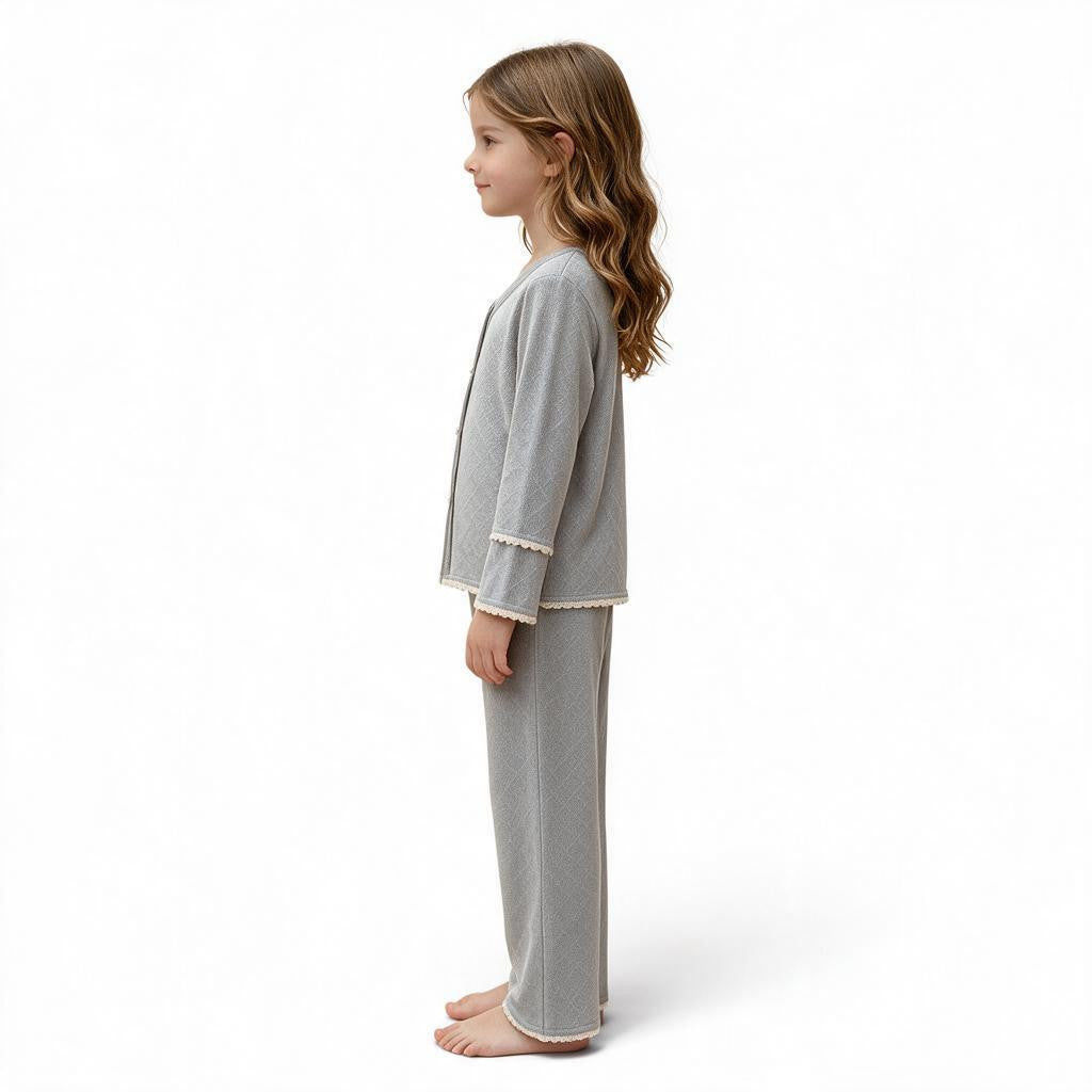 JOANNA FASHION girls grey long sleeve button down pajama set with scalloped lace trim worn by a young girl