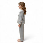 JOANNA FASHION girls grey long sleeve button down pajama set with scalloped lace trim worn by a young girl